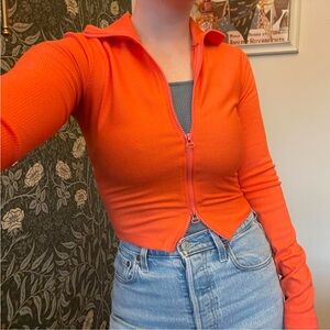 Small Urban Outfitters neon orange zip-up top